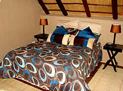 Malelane Self catering lodge accommodation at Khaya Umdani Self catering lodge in Mpumalanga - Bushbaby Bedroom