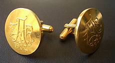 Cufflinks made from the press and dies that were used to mint the original veld ponde at Pilgrims Rest during the Anglo Boer War